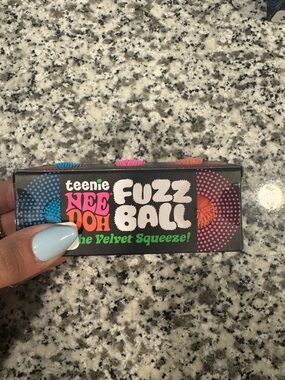 Teenie NeeDoh Fuzz Ball 3 Pack. Blue, Pink, and Coral
